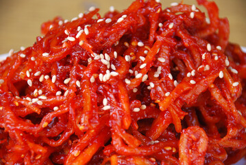 Side dish of squid greens red pepper paste