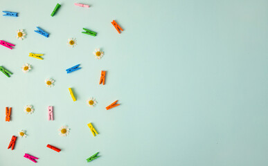 Colorful clothes pin or Colorful clothes peg, wooden clamps on blue background