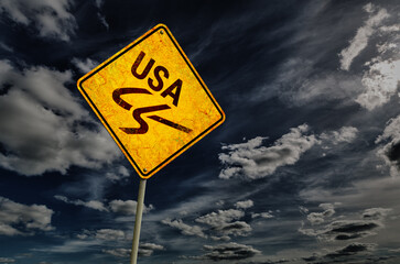 Dark blue cloudy sky and yellow rhombic road sign - 495432701