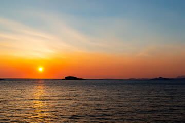 Obraz premium Orange sunset over a sea