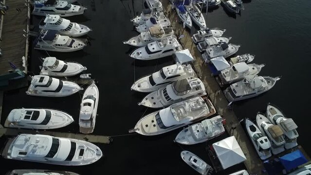 Expensive boats and yachts docked at Seattle's South Lake Union dock.