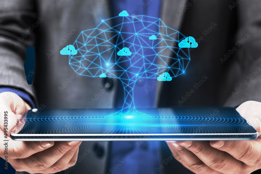 Aufkleber close up of businessman hand holding tablet with abstract digital polygonal cloud tree on blue backg