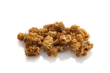 Close-up dried red mulberry fruits on white