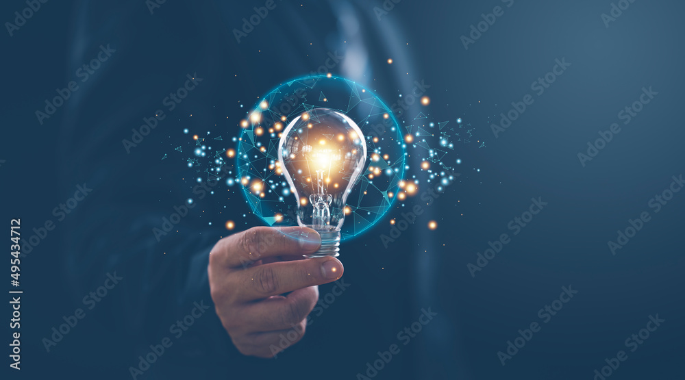 Poster hand of businessman holding illuminated light bulb with network connection line, idea, innovation an