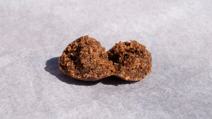 pieces of hashish on paper closeup ,crumpled cannabis trichomes.