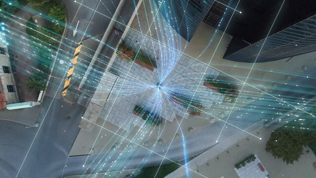 Big City Business Partners Use Laptop Computer in Urban Park. E-Commerce Visualization of Information Lines Flying from Laptop into Global Digital Network. Top-Down Zoom Out Aerial Drone Shot.