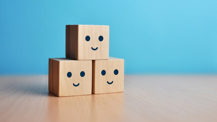 Wooden cubes with smiles. A symbol of choice joy and positivity