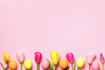 Naklejka na ściany i meble Easter composition tulips and eggs on pink background