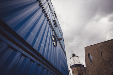 Blue building under white clouds