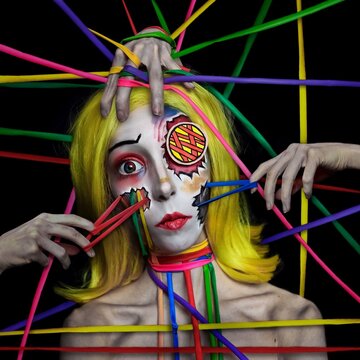 Graphic image of woman with colorful strings pulled from her face