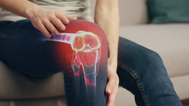 VFX Joint and Knee Pain Augmented Reality Animation. Close Up of a Person Experiencing Discomfort in a Result of Leg Trauma or Arthritis. Massaging the Muscles to Ease the Injury.