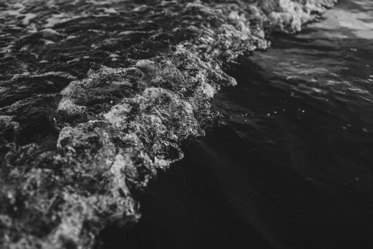 Grayscale photo of ocean waves
