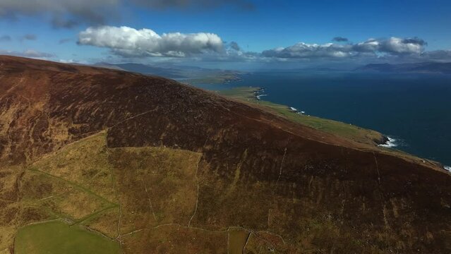 Ventry, Kerry, Ireland, March 2022. Drone ascends above the Dingle Peninsula while facing east above the North Atlantic Ocean with Coon, Reenbeg and the Doonites in the distance.