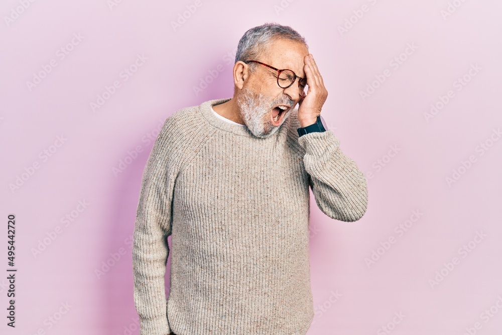 Sticker Handsome senior man with beard wearing casual sweater and glasses yawning tired covering half face, eye and mouth with hand. face hurts in pain.