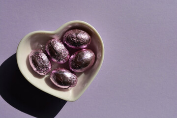 Easter eggs in heart shaped dish
