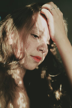 Portrait Of Mature White Woman Touching Her Hair