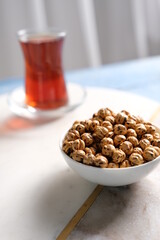 Roasted yellow chickpeas in wooden bowl