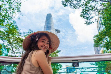 Sightseeing tour buses in Ho Chi Minh city, Vietnam. Hop on hop off tourist bus and Vietnamese...