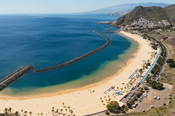 Playa Las Teresitas in Santa Cruz, Tenerife, Canary Islands. View from above in a beautiful sunny day, with blue ocean waters and sandy beach.