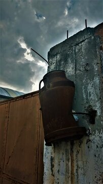 Rusted tank on a wall