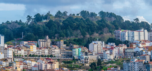 Fototapeta premium A view from the estuary towards the Old Quarter of Vigo, Spain on a spring day