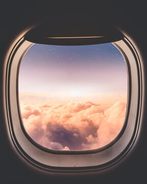Sunset clouds through airplane window