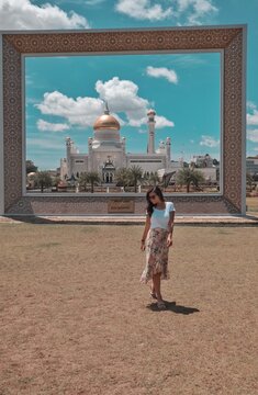 Woman walking near Omar Ali Saifuddien Mosque, Brunei