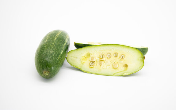 whole and chopped pointed gourd isolated on white background