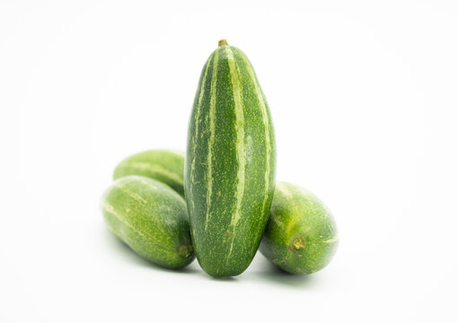 Pointed gourds over white background