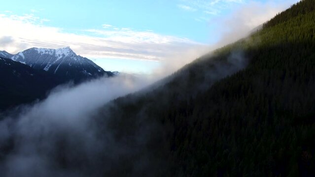 Aerial view of fog rolling through Snoqualmie Pass.