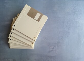 Old computer diskette, unlabeled, isolated .