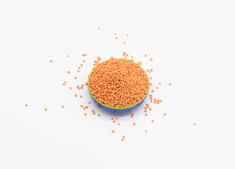 Red lentils pile isolated on white background, also known as raw daal, masoor dhal