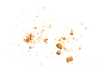 Scattered crumbs of vanilla chip butter cookies isolated on white background. Close-up view of...