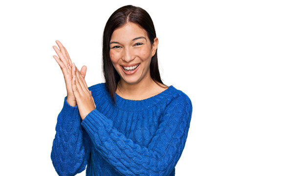 Young hispanic woman wearing casual clothes clapping and applauding happy and joyful, smiling proud hands together