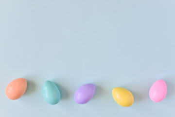 Easter postcard with bed-colored eggs with a copy of the place for the text.