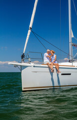 Loving couple sitting on yacht enjoying relaxed retirement