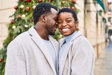 Man and woman couple smiling confident standing together at street