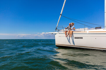 Senior couple enjoying relaxing vacation on luxury yacht