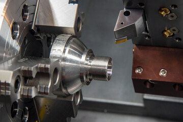 The  CNC lathe machine thread cutting the metal shaft parts. - obrazy, fototapety, plakaty