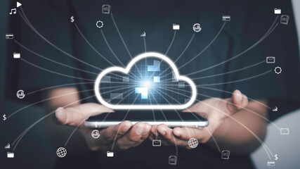 Cloud technology,Technology transformation, Data security concept. Hand holding virtual screen cloud icons Downloading and uploading data application on smartphone.