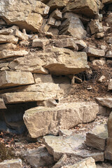 Stacked, rough old stones near a hiking trail by an old quarry in Western Pennsylvania.
