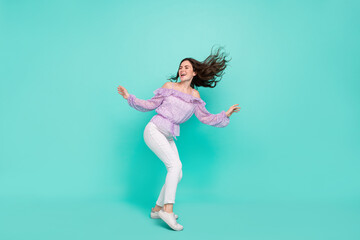 Full length body size view of attractive cheerful dreamy girl dancing having fun isolated over bright blue color background
