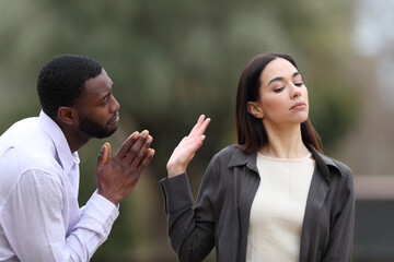 Man begging forgive and woman rejecting him