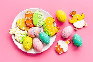 Fototapeta na wymiar Easter cookies eggs and bunny on plate. Happy Easter background