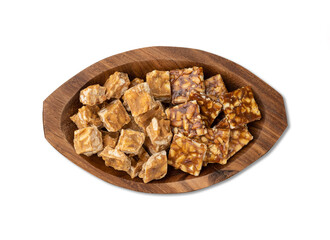 Pe de moleque, typical brazilian peanut candy isolated over white background. June festival food