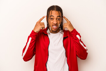 Young African American man isolated on white background showing a disappointment gesture with forefinger.