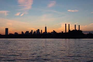 Lower Manhattan Skyline Silhouette during a Colorful Sunset along the East River in New York City