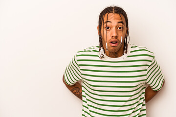 Young African American man isolated on white background being shocked because of something she has seen.