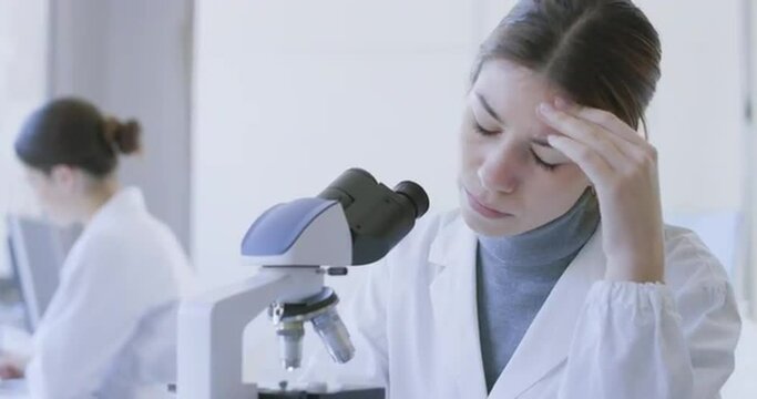 Stressed researcher having a headache