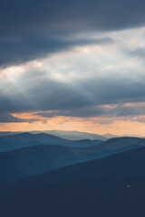Fototapeta na wymiar the light in the mountains breaks through the clouds Ukraine Carpathians